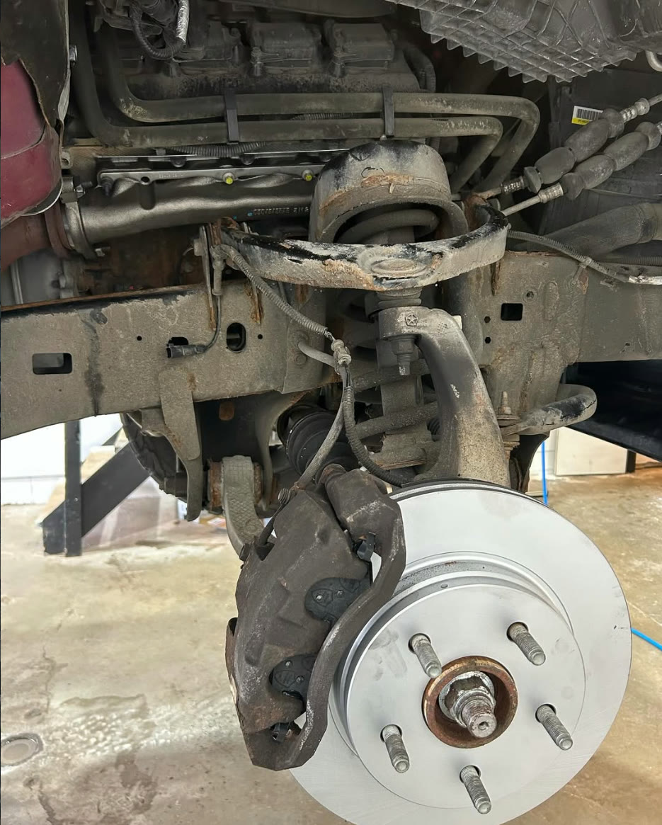 Ram front suspension with a new brake rotor installed